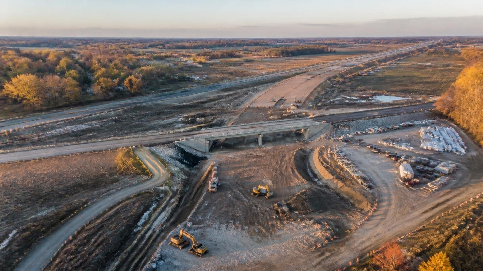Illustration: an aerial view of civil earthworks and road construction